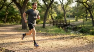 pair of premium stability running shoes for men placed on an outdoor running track, showcasing structured arch support.