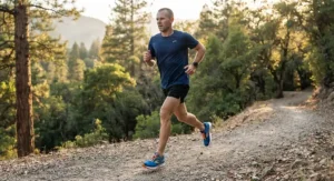 An illustration of a male athlete running smoothly on a road wearing protective neutral running shoes.