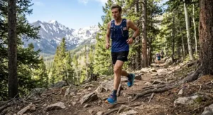 A trail runner navigating a dirt path in max cushion shoes designed for men's long distance off-road running.