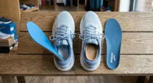 Top-down view of motion control running shoes for women with flat feet showing removable insoles for custom orthotics.