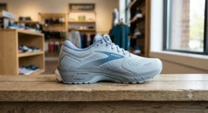 Close-up of a women's stability running shoe highlighting the dense medial post for overpronation control.