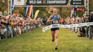 Runner crossing the finish line in minimalist racing flats for 5k events
