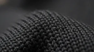 A close-up shot of smooth, anti-pilling fabric texture on men's running tights after multiple wash cycles.