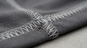 Close-up view highlighting the reinforced seam construction on a pair of men's running tights.